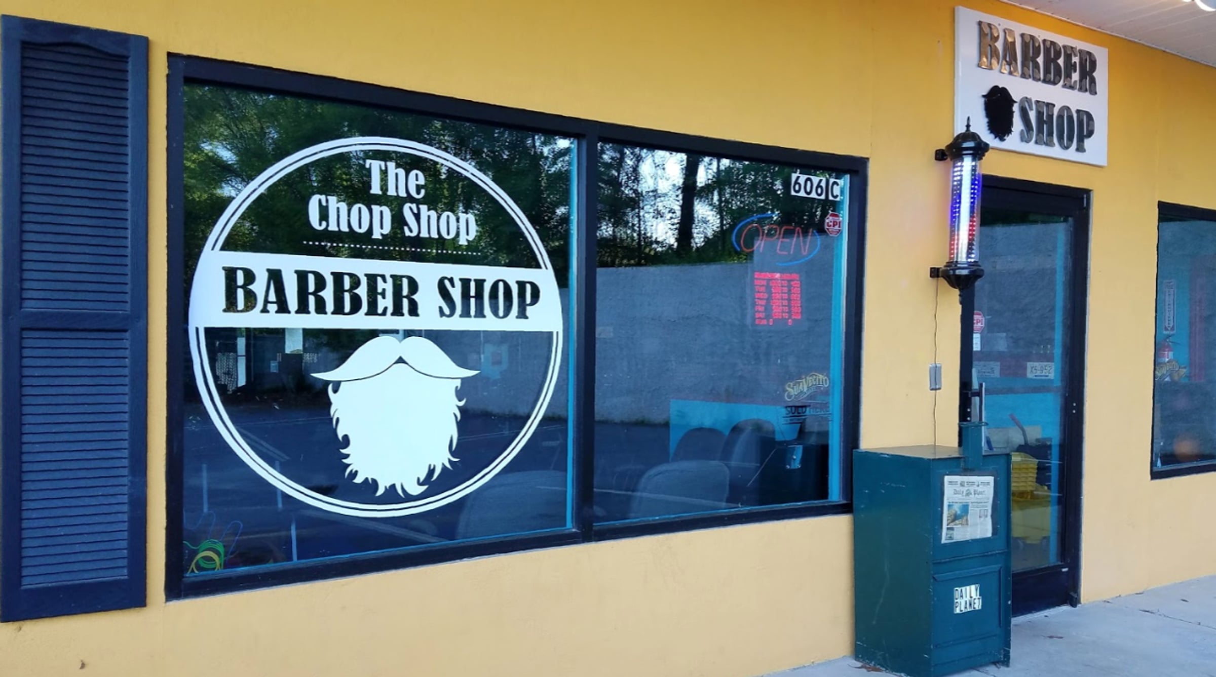The yellow storefront and entrance to The Chop Shop in Asheville