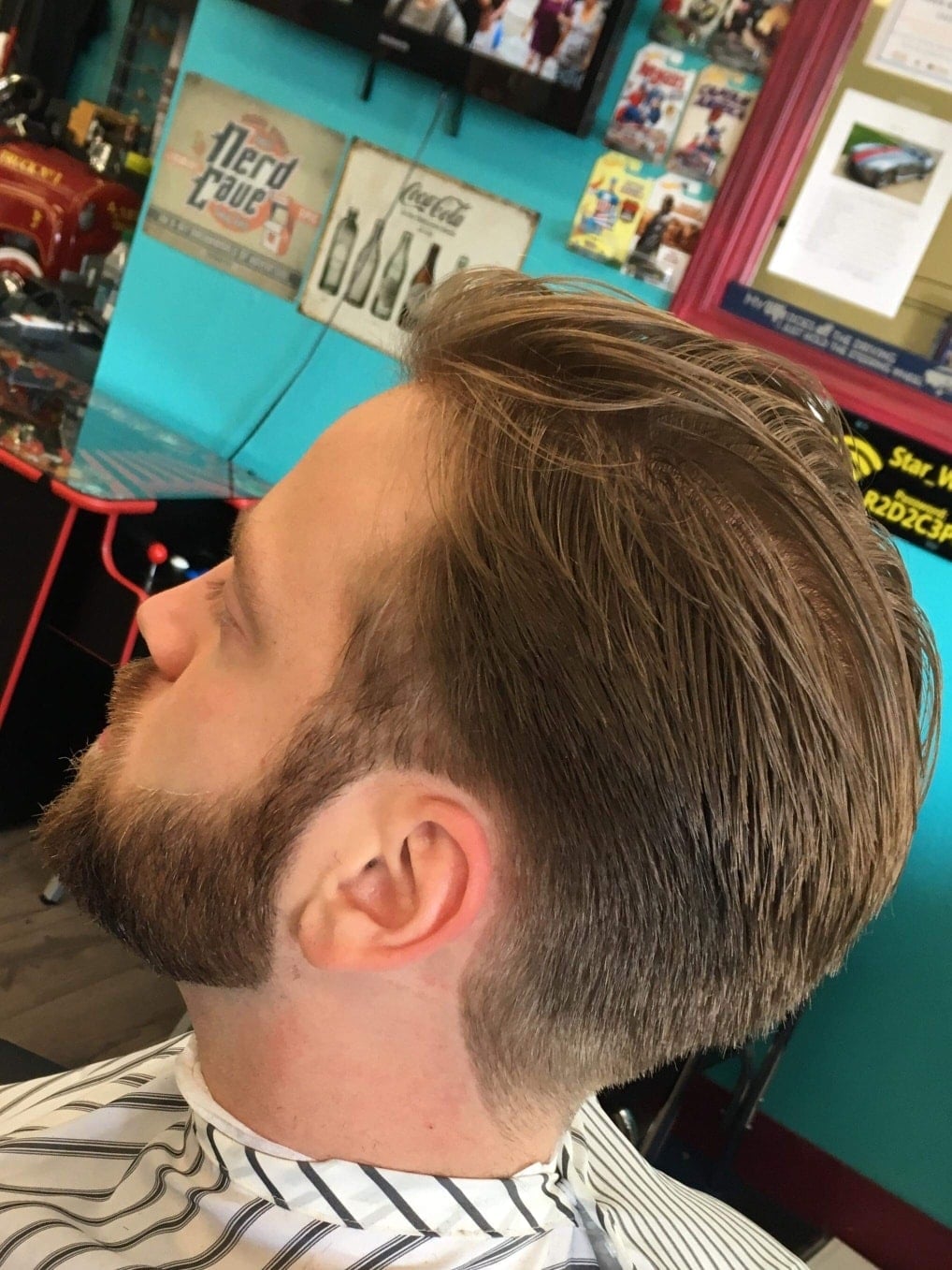 A finished classic haircut and neatly shaped beard